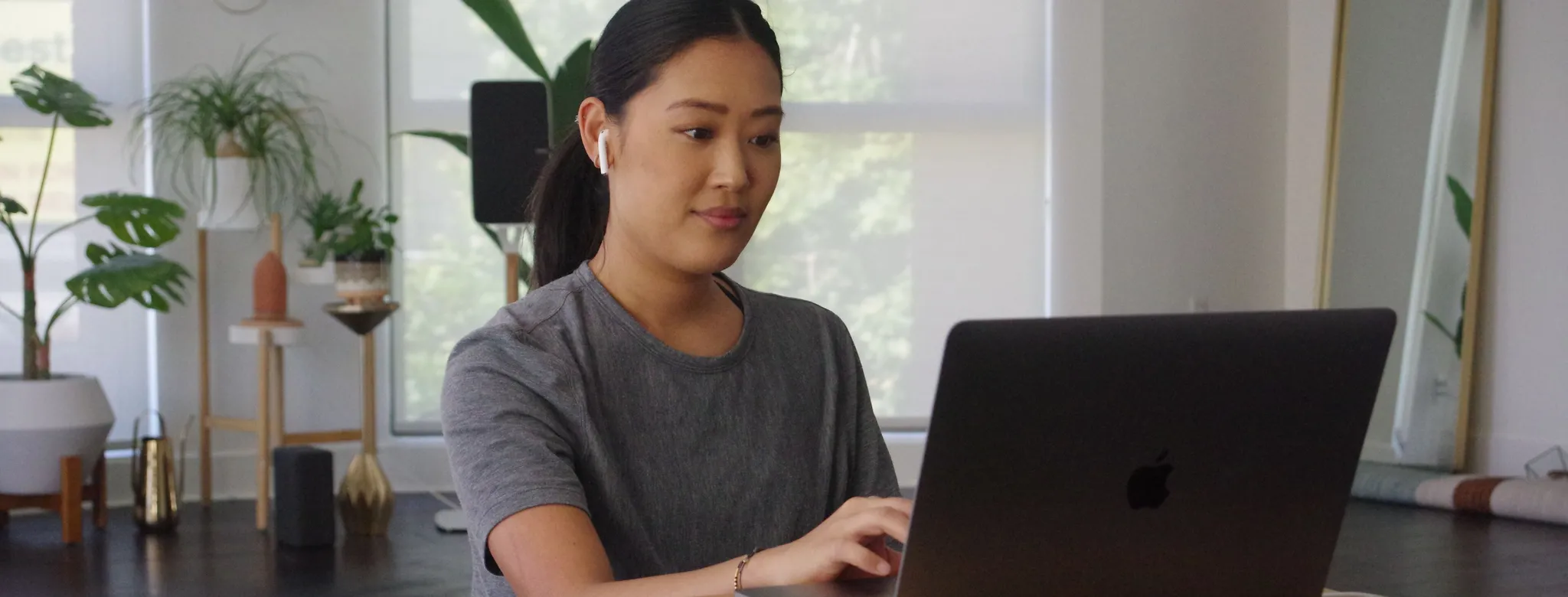 woman on her laptop in living room